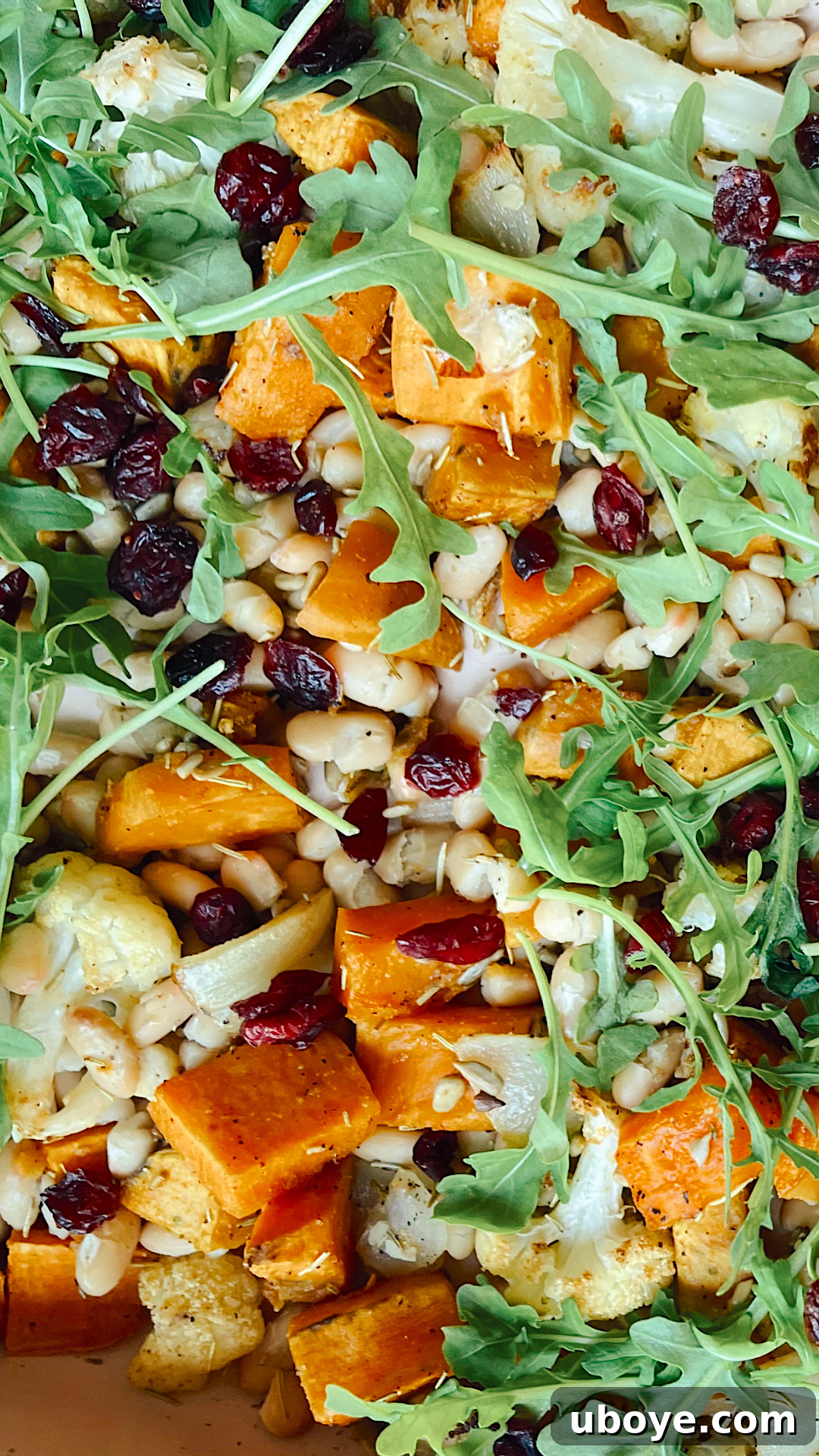 Tray bake with cauliflower and sweet potato seasoned and spread out