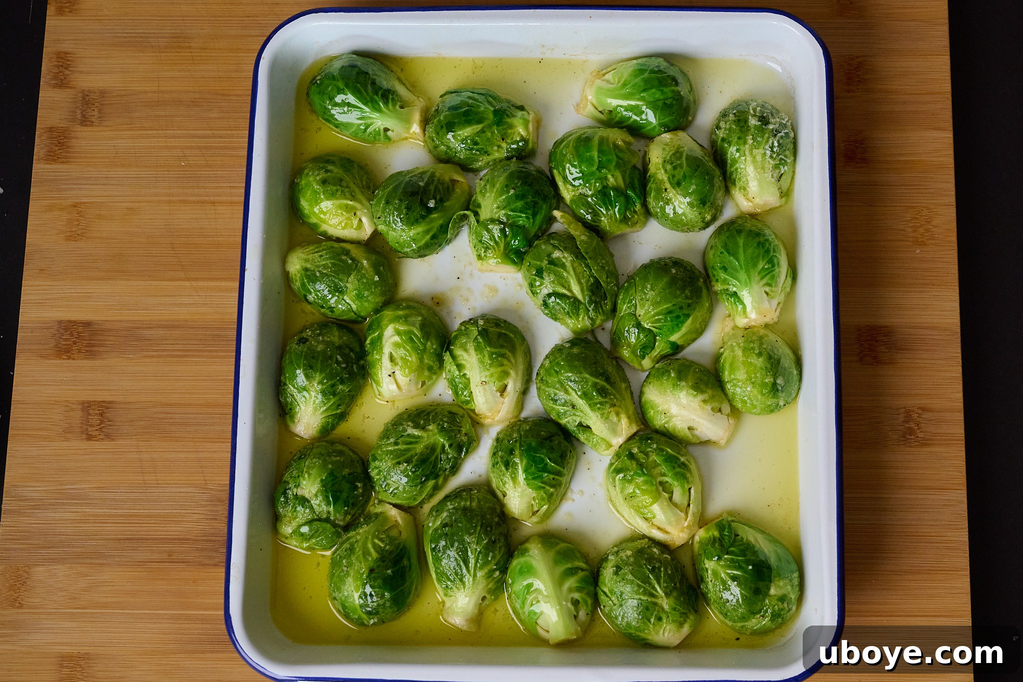 Brussels sprouts are on roasting tray.
