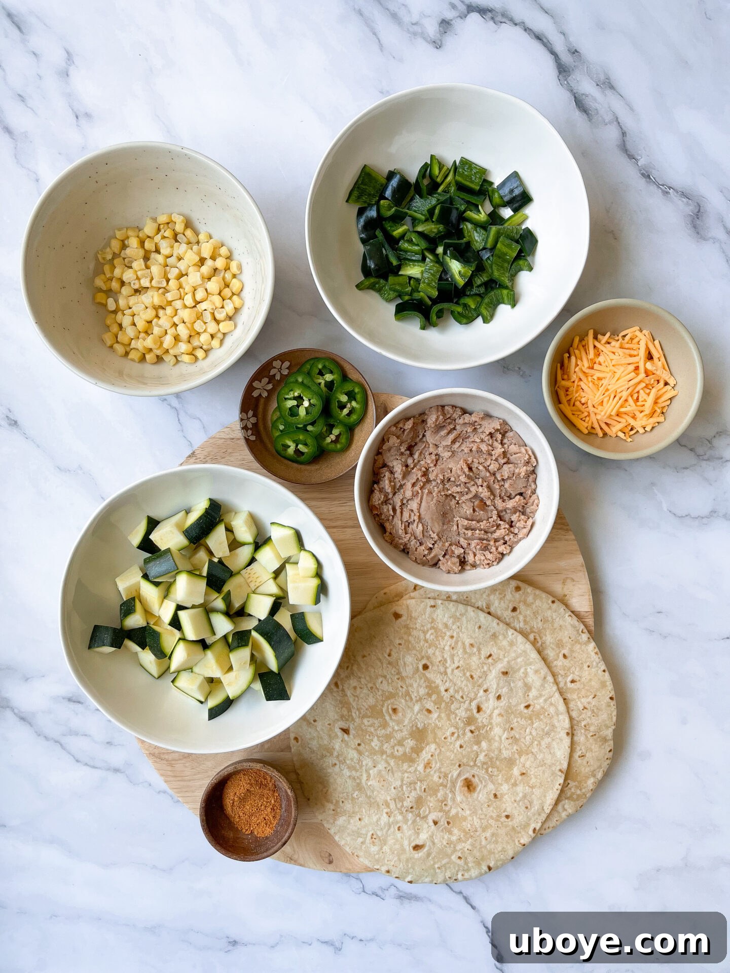 Flavor-Packed Baked Veggie Tacos 4 A stack of golden-brown oven-baked veggie tacos on a baking sheet, fresh out of the oven.
