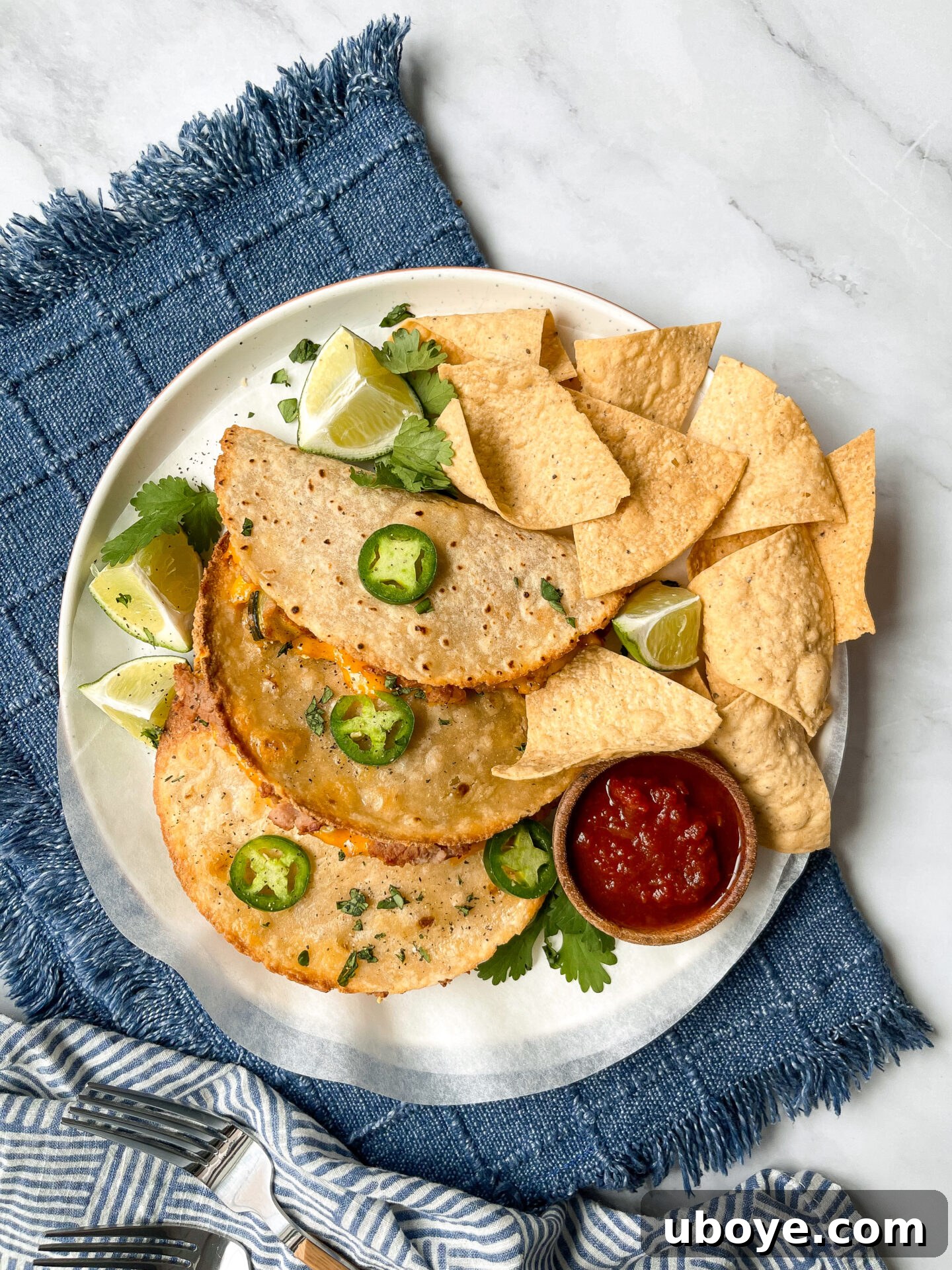 Flavor-Packed Baked Veggie Tacos 7 Freshly baked crispy oven-baked veggie tacos arranged beautifully on a plate with salsa and lime wedges.