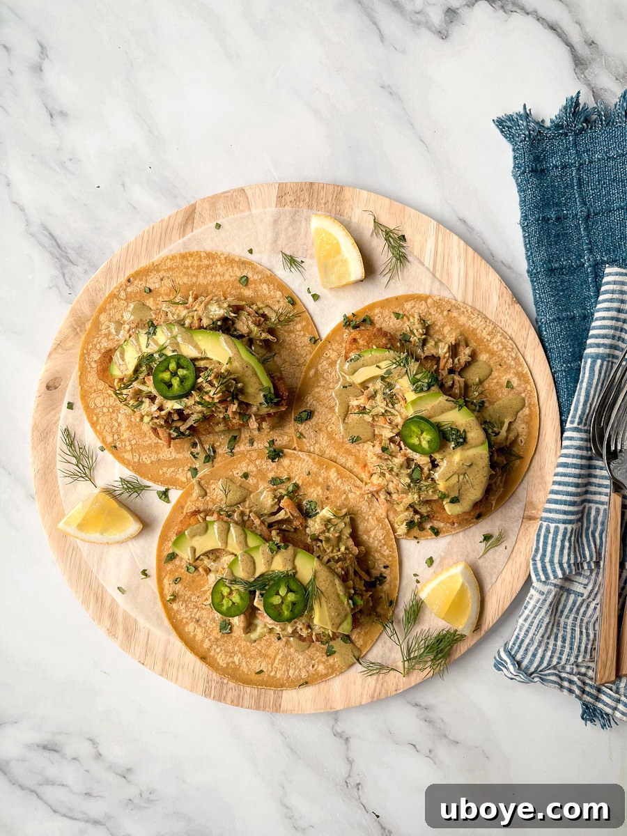 Crispy Plant-Based Chick'n Tacos with Zesty Slaw 4 A beautifully presented vegan chicken taco with fresh slaw and sauce, ready to eat