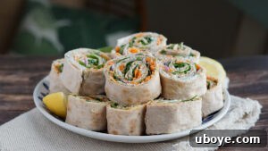 Effortless Pinwheel Creations 11 Sliced pinwheels arranged on a serving plate, ready to be enjoyed