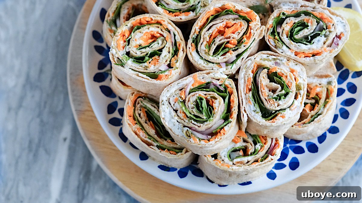 Effortless Pinwheel Creations 6 Close-up of freshly sliced vegan pinwheels ready to be served, showing perfectly rolled layers