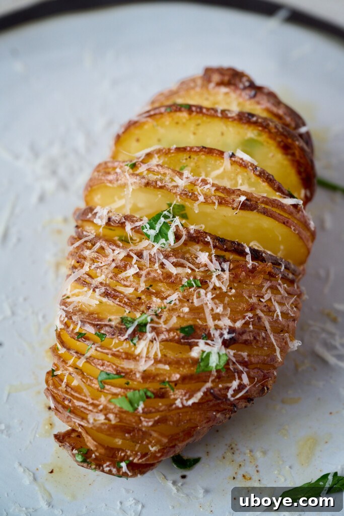 Plated garlic butter hasselback potatoes as a side dish
