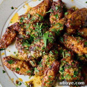 Crispy oven-baked chicken wings with lemon, honey, and garlic sauce
