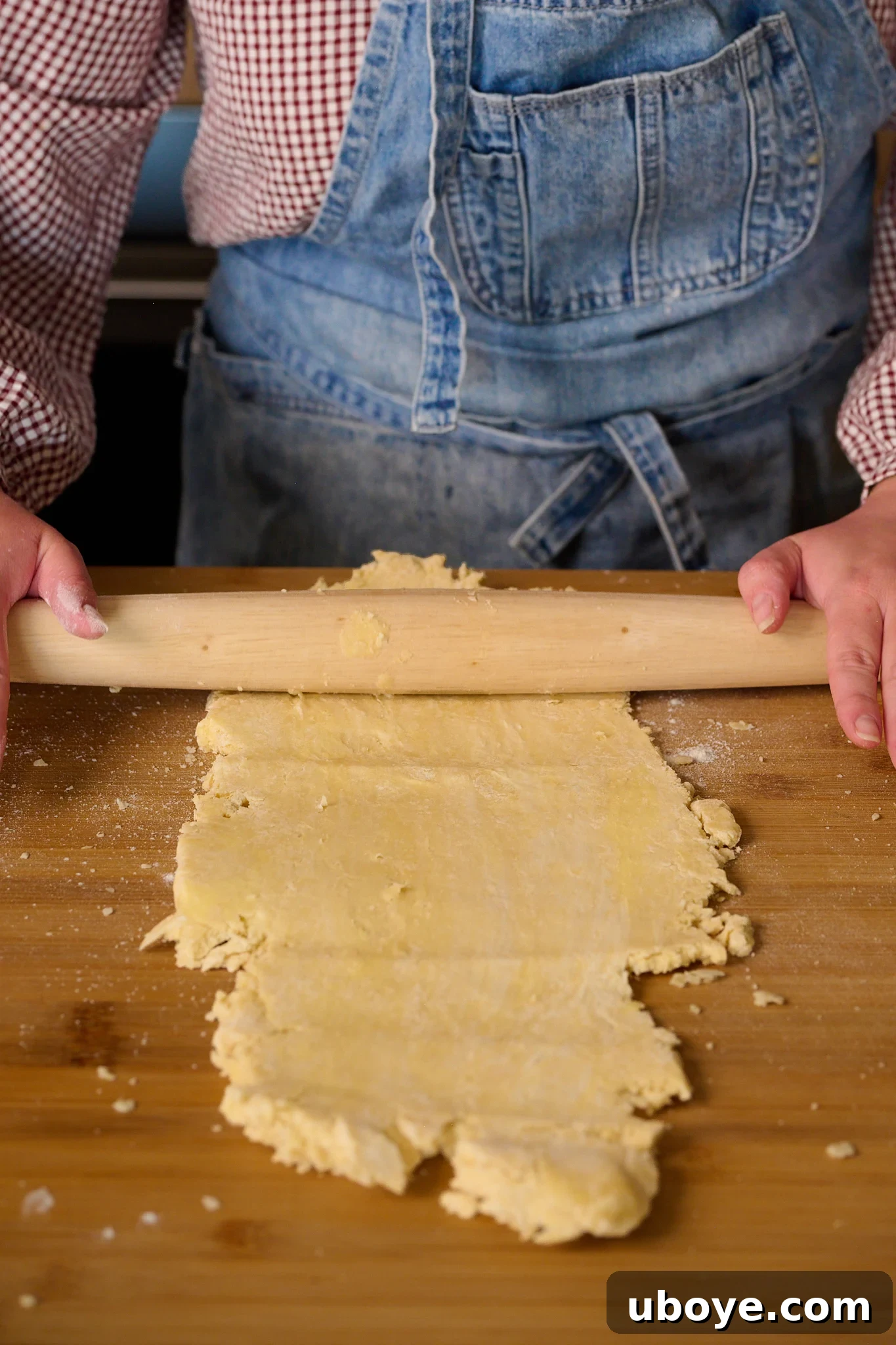 Hearty Chicken, Mushroom and Bacon Pot Pie 6 puff pastry is being rolled out with rolling pin.