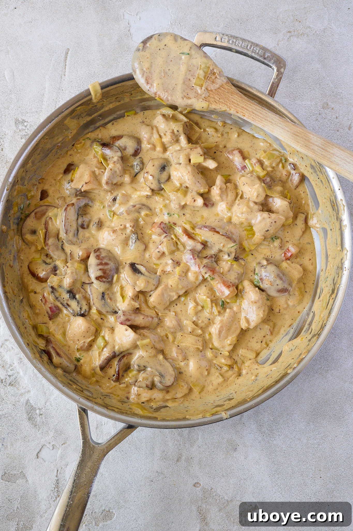Hearty Chicken, Mushroom and Bacon Pot Pie 10 filling for Creamy Chicken, Mushroom & Bacon Pot Pie is in stainless steel pan