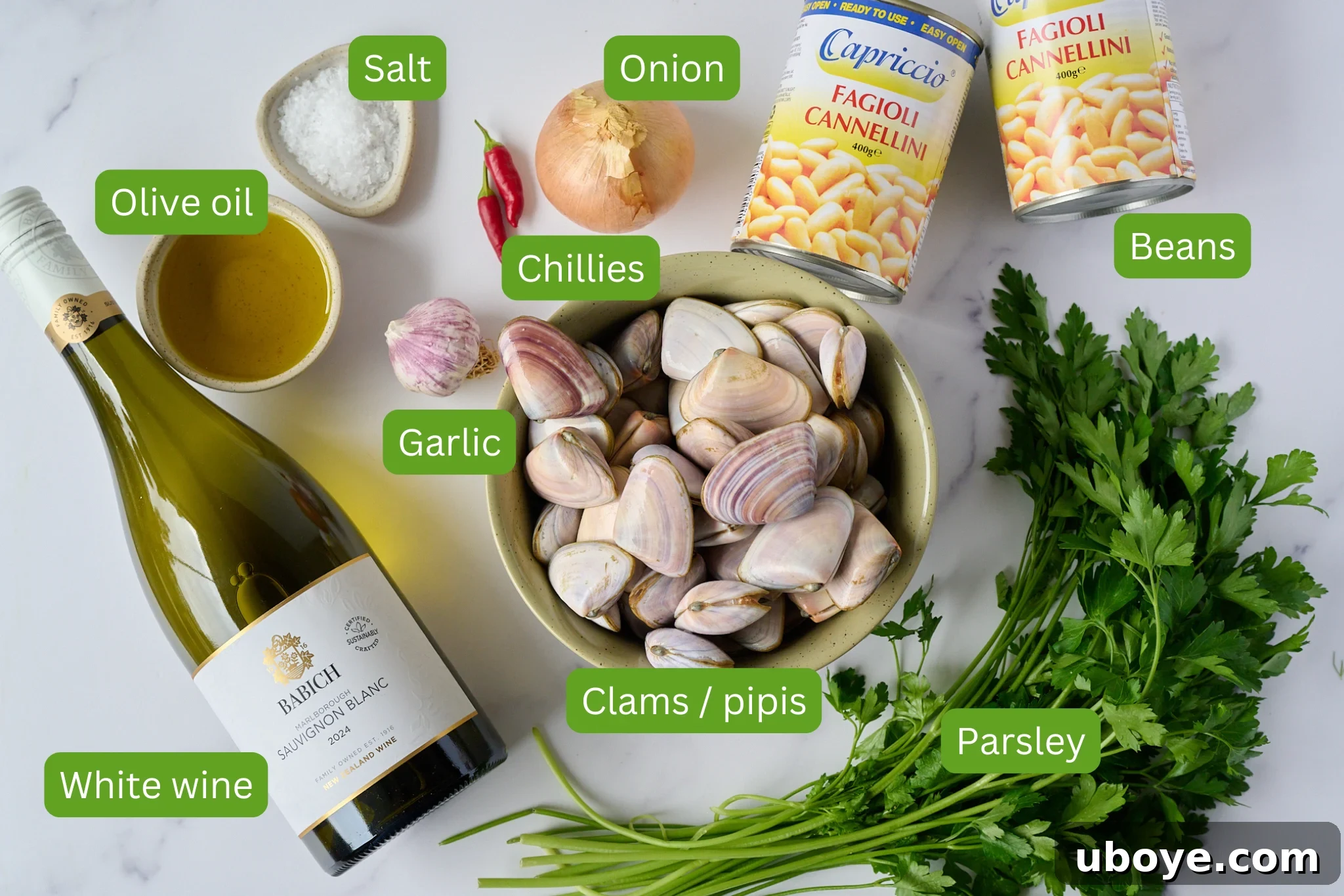Rustic Spanish Clam and White Bean Pot 4 Ingredients for Spanish white bean and clam stew are shown. This includes white wine, olive oil, garlic, salt, chillies, onion, beans, parsley and clams.
