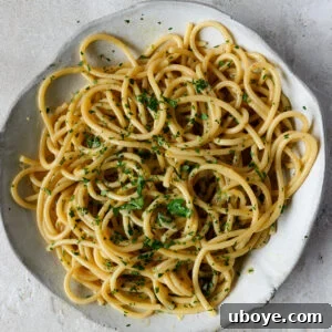 A prepared plate of Anchovy Butter Pasta with fresh parsley.