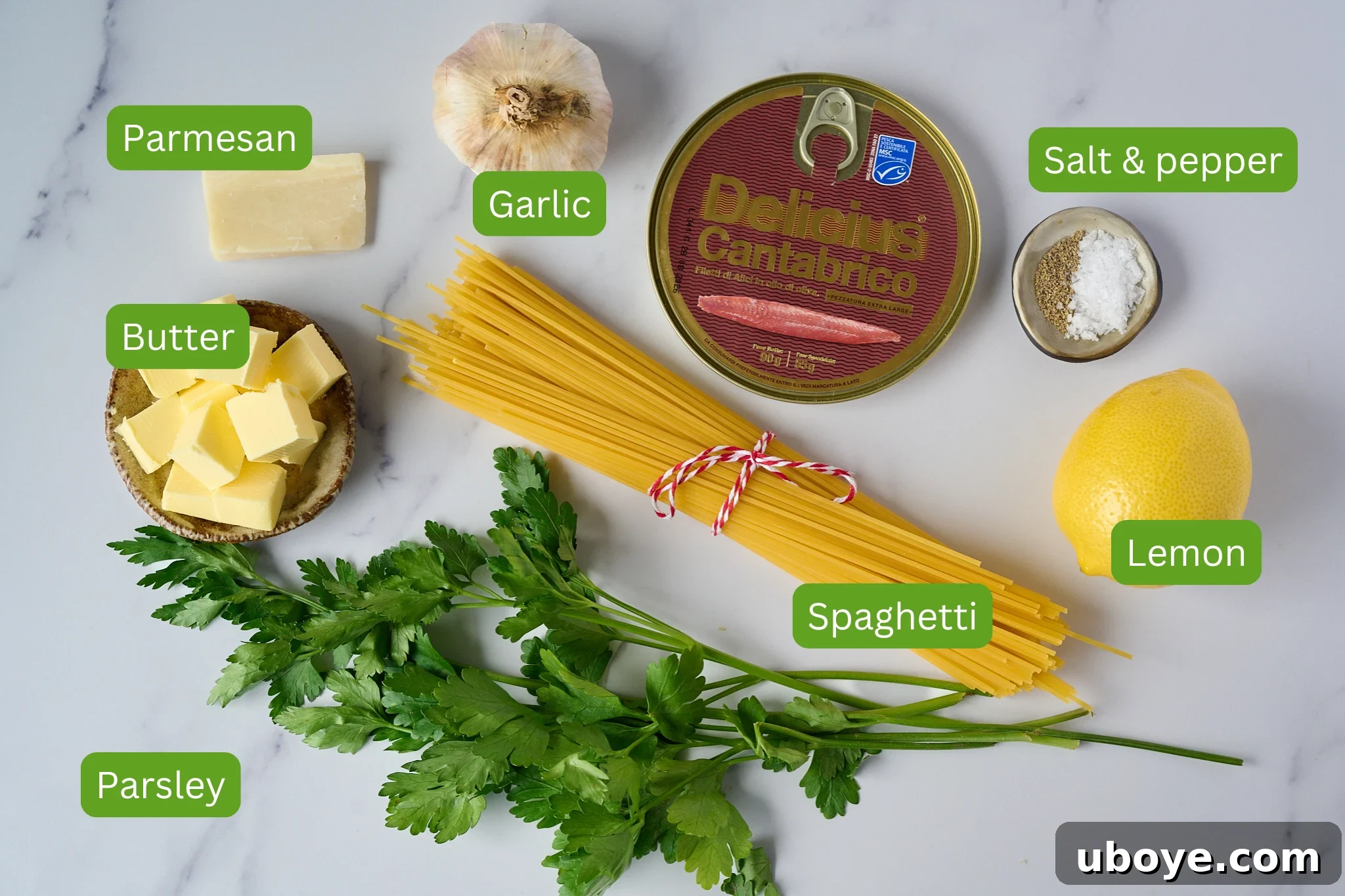 Decadent 10-Minute Anchovy Butter Pasta 4 A collection of the simple ingredients needed for anchovy butter pasta, including pasta, a tin of anchovies, butter, garlic, lemon, and fresh parsley.