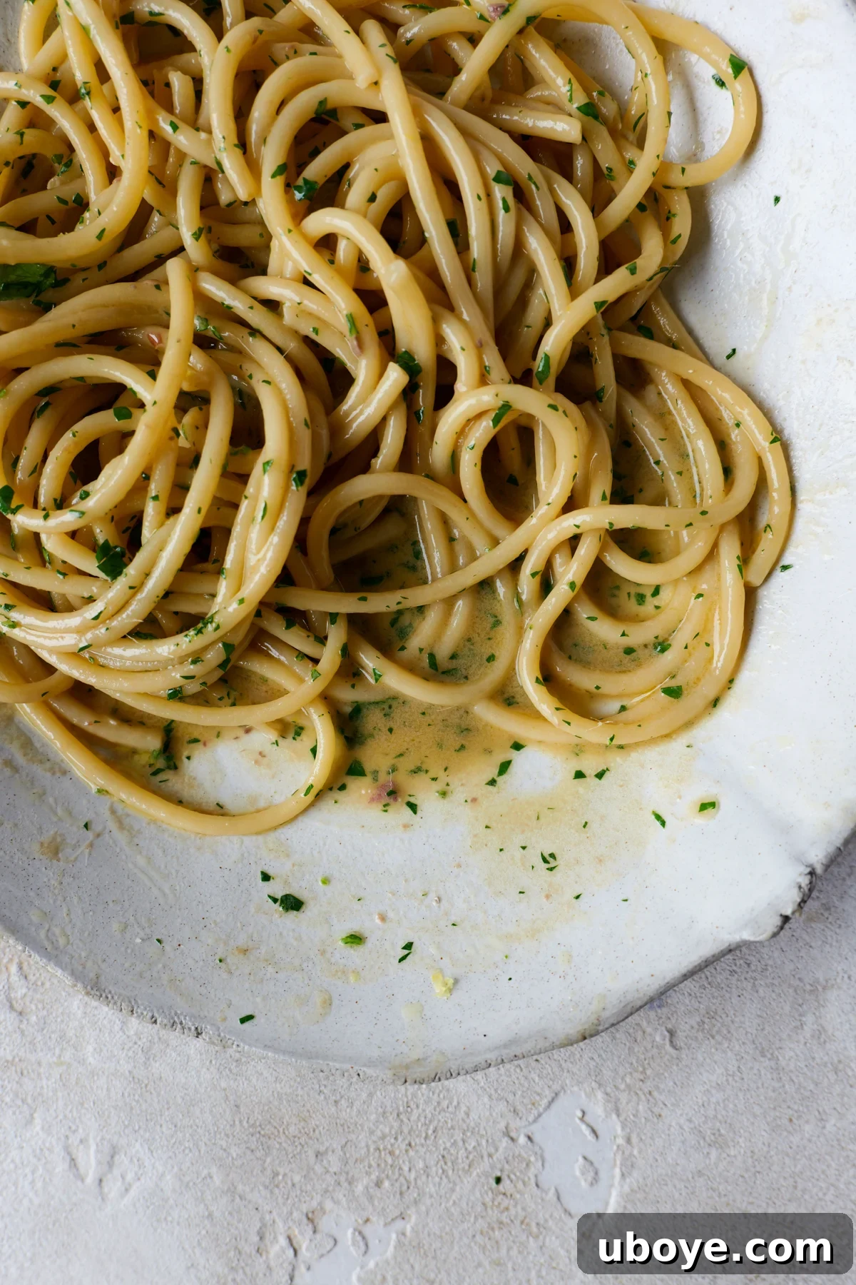 Decadent 10-Minute Anchovy Butter Pasta 8 A freshly prepared bowl of anchovy butter pasta, garnished with abundant fresh parsley, ready for serving.