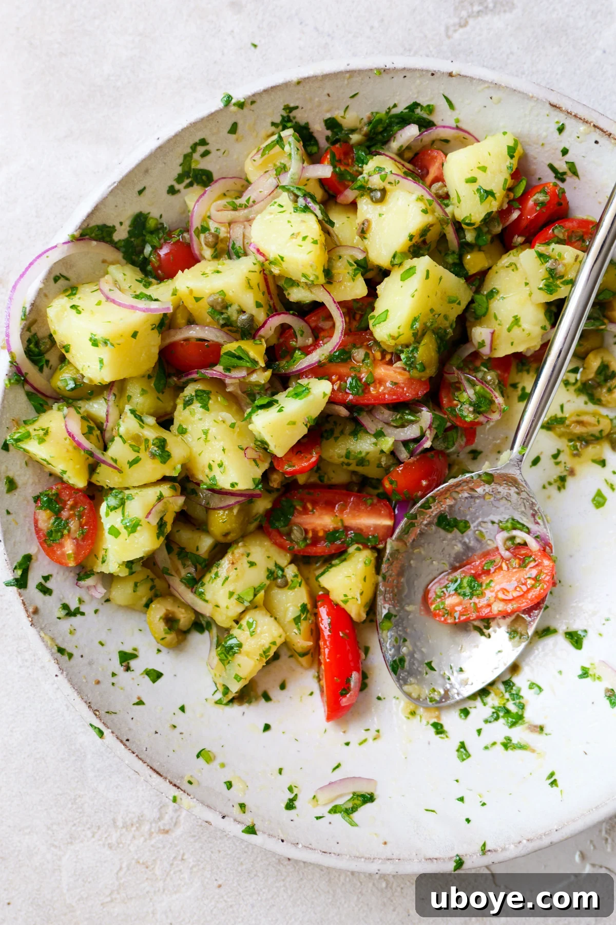 Italian-Style Potato Salad (Mayo & Dairy-Free Recipe) 6 Italian potato salad in large white bowl with lots of fresh parsley sprinkled all over.